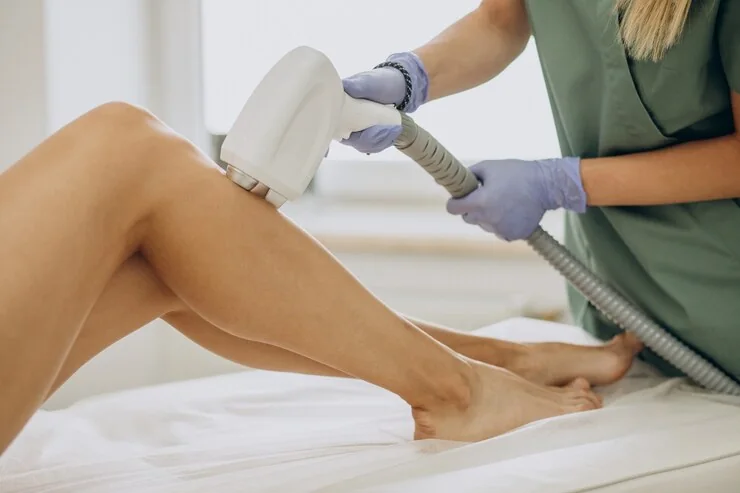 Laser hair removal being performed on a patient's leg